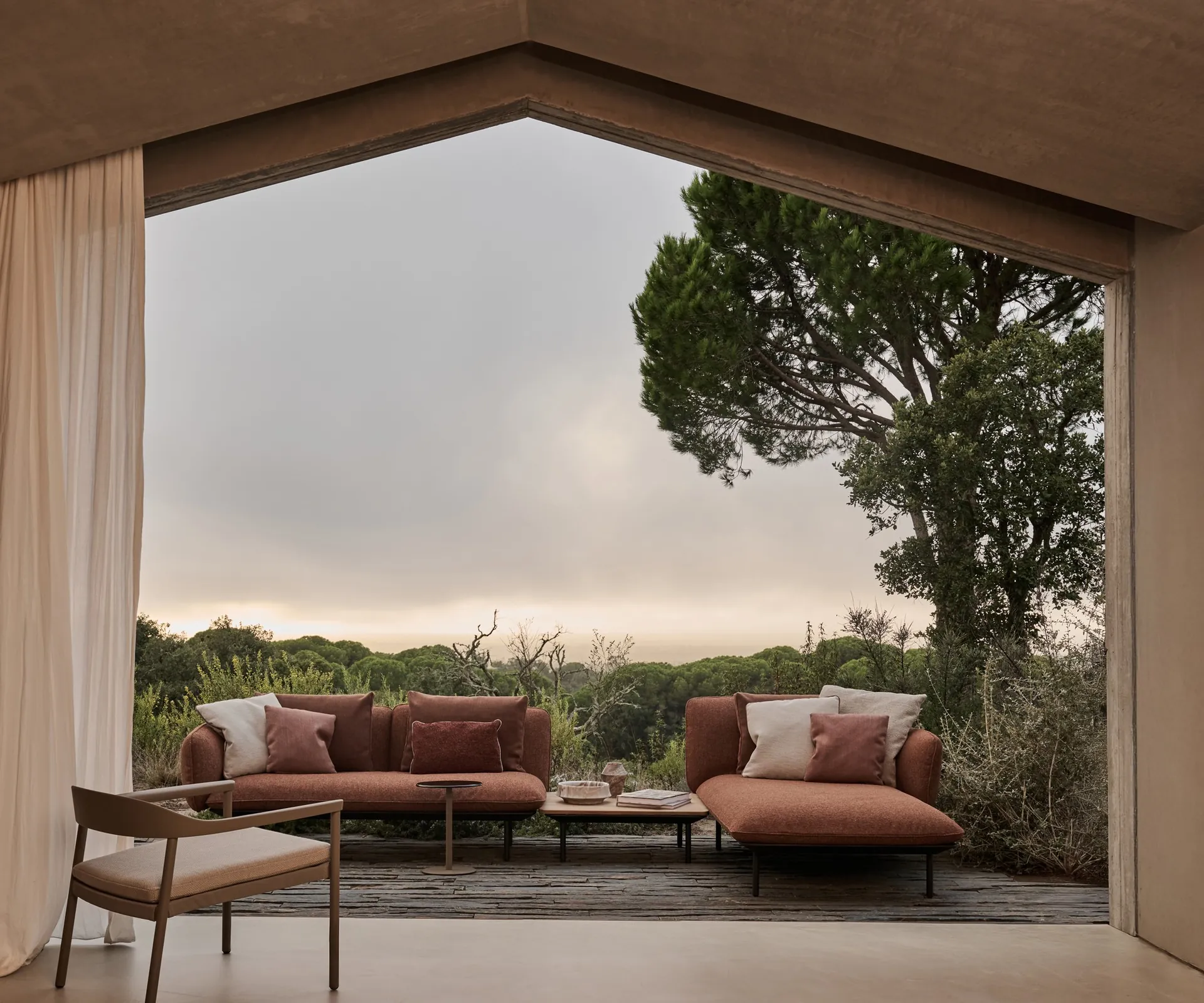 Tribù Illum aluminum dining chairs and table on an open terrace